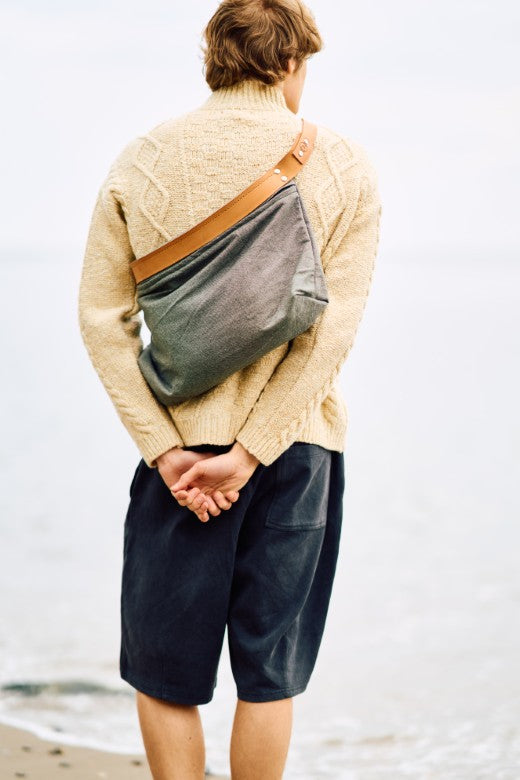 Grey deadstock canvas cross body bag with tan leather straps, handmade by Mark Ingles for our Irish-sourced collection.