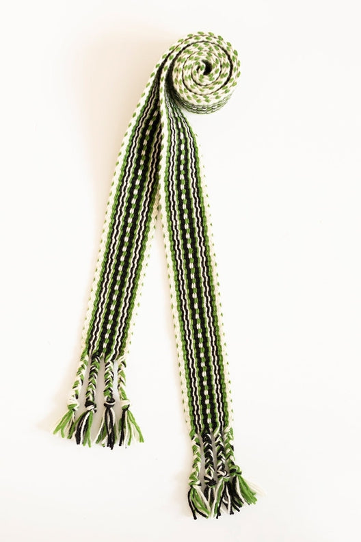 Handwoven Irish Crios belt in green, black, and white wool, crafted by traditional Aran Island artisans.