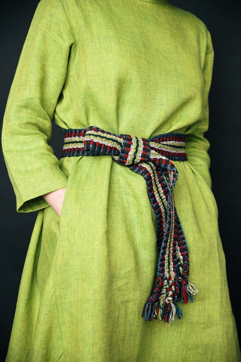Handwoven Irish Crios belt featuring vibrant, multi-colored wool stripes, crafted by traditional Aran Island artisans.