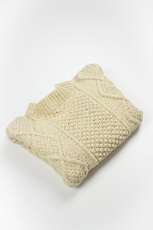 Cream merino wool handknit Aran jumper featuring traditional blackberry and cable stitch patterns by Irish makers.