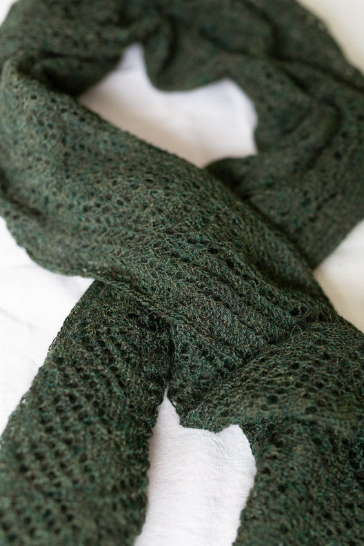 Peat green alpaca wool scarf featuring intricate Irish lace patterns, hand-knit by Marian for a soft, durable finish.