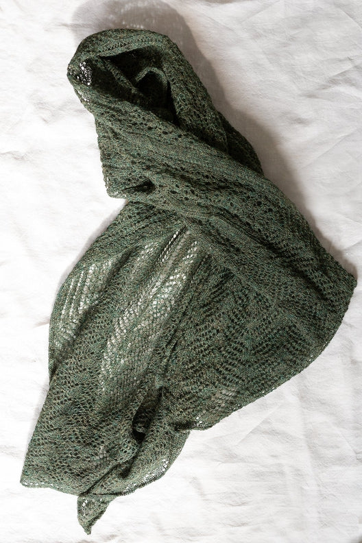 Peat green alpaca wool scarf featuring intricate Irish lace patterns, artisan-knit for a soft, durable, oversized drape.