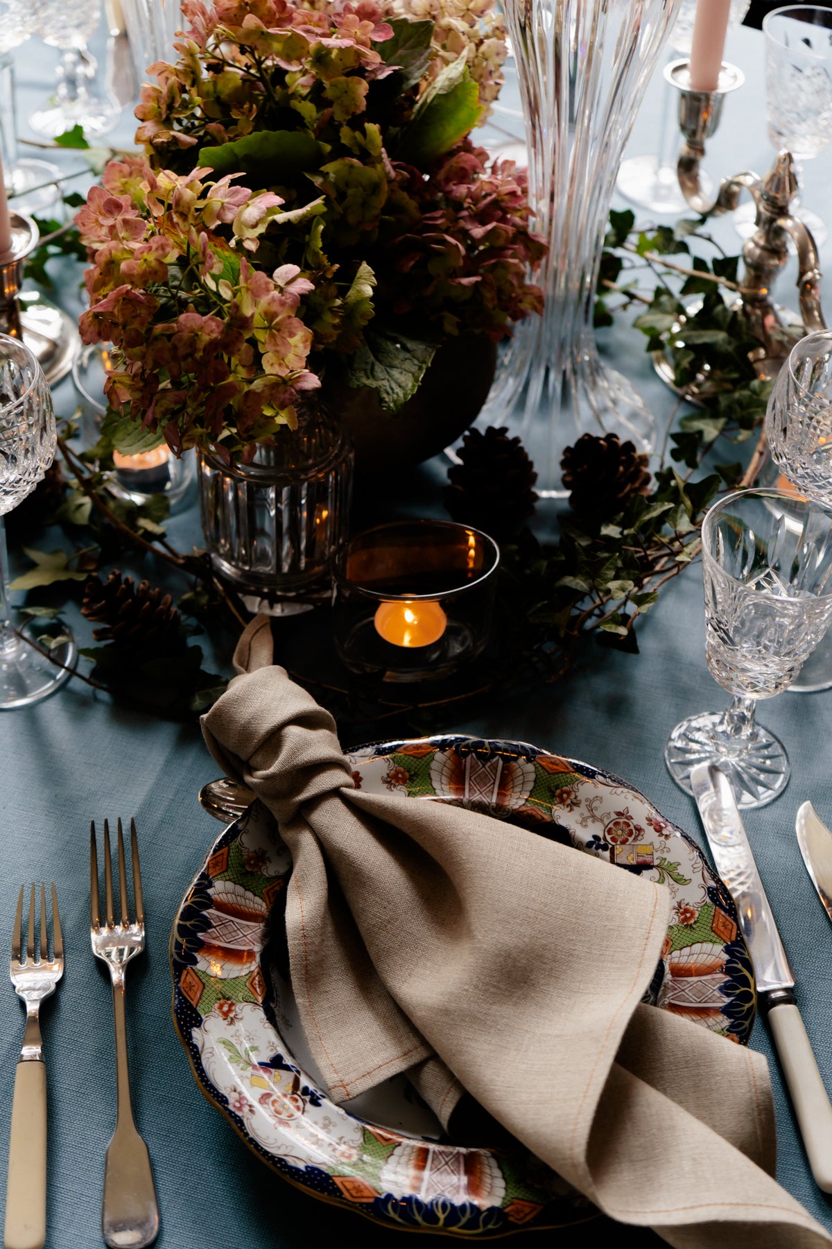 Handmade heavy-weight Irish linen napkin in natural beige, styled on a decorative plate by Irish artisans.
