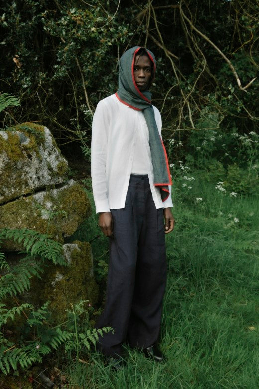 Unisex white Irish linen shirt featuring a stiffened collar and signature orange stitch, crafted from premium Emblem Weavers fabric.