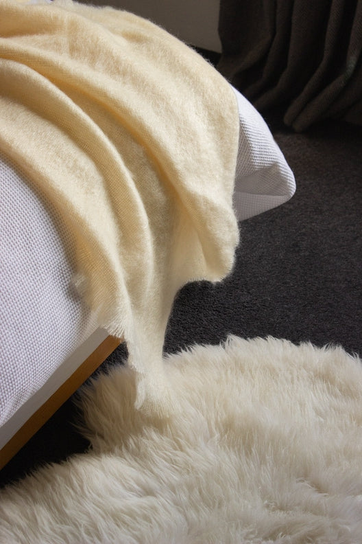 Luxurious cream Irish sheepskin rug handcrafted by local artisans, featuring soft, long-pile wool for a cozy home aesthetic.