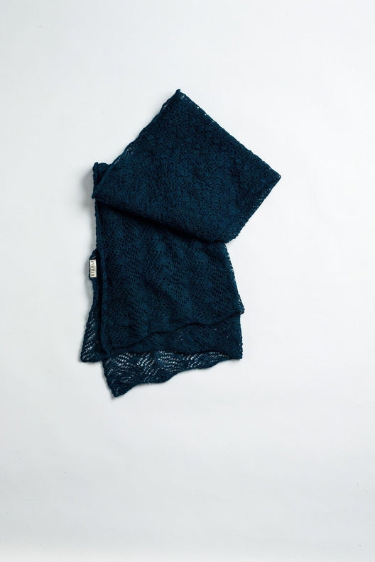 Teal blue alpaca knit shawl featuring intricate Irish lace patterns, handcrafted by Marian for a soft, durable finish.